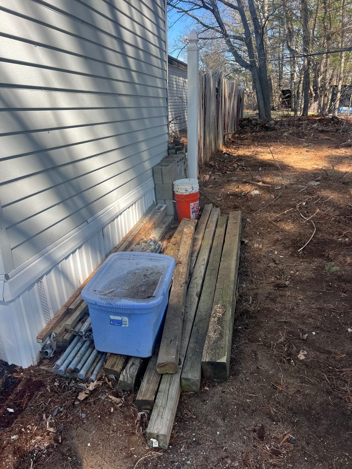 After: deck covered with tarps, buckets, and clutter, then cleared and tidied