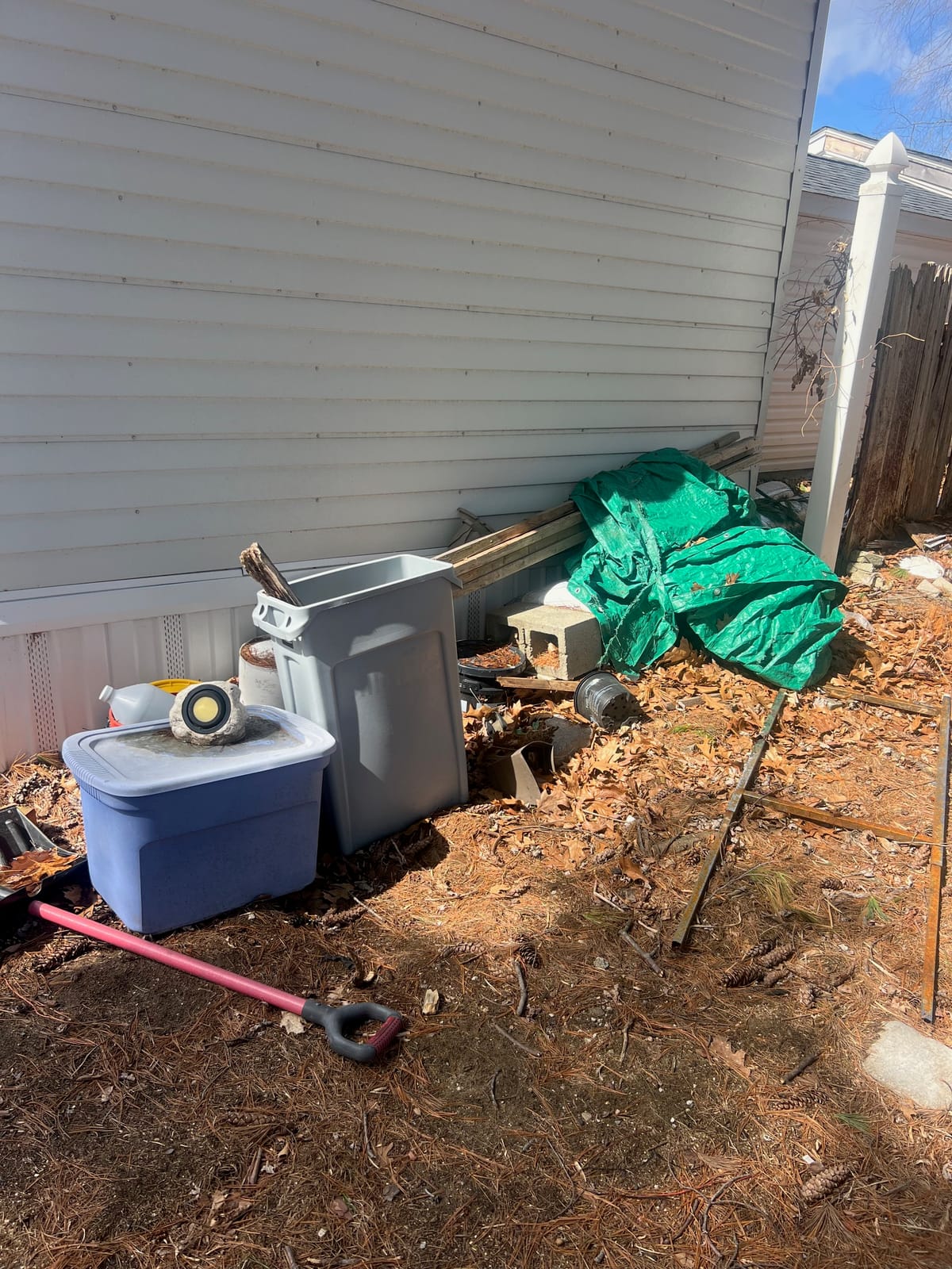Before: deck covered with tarps, buckets, and clutter, then cleared and tidied
